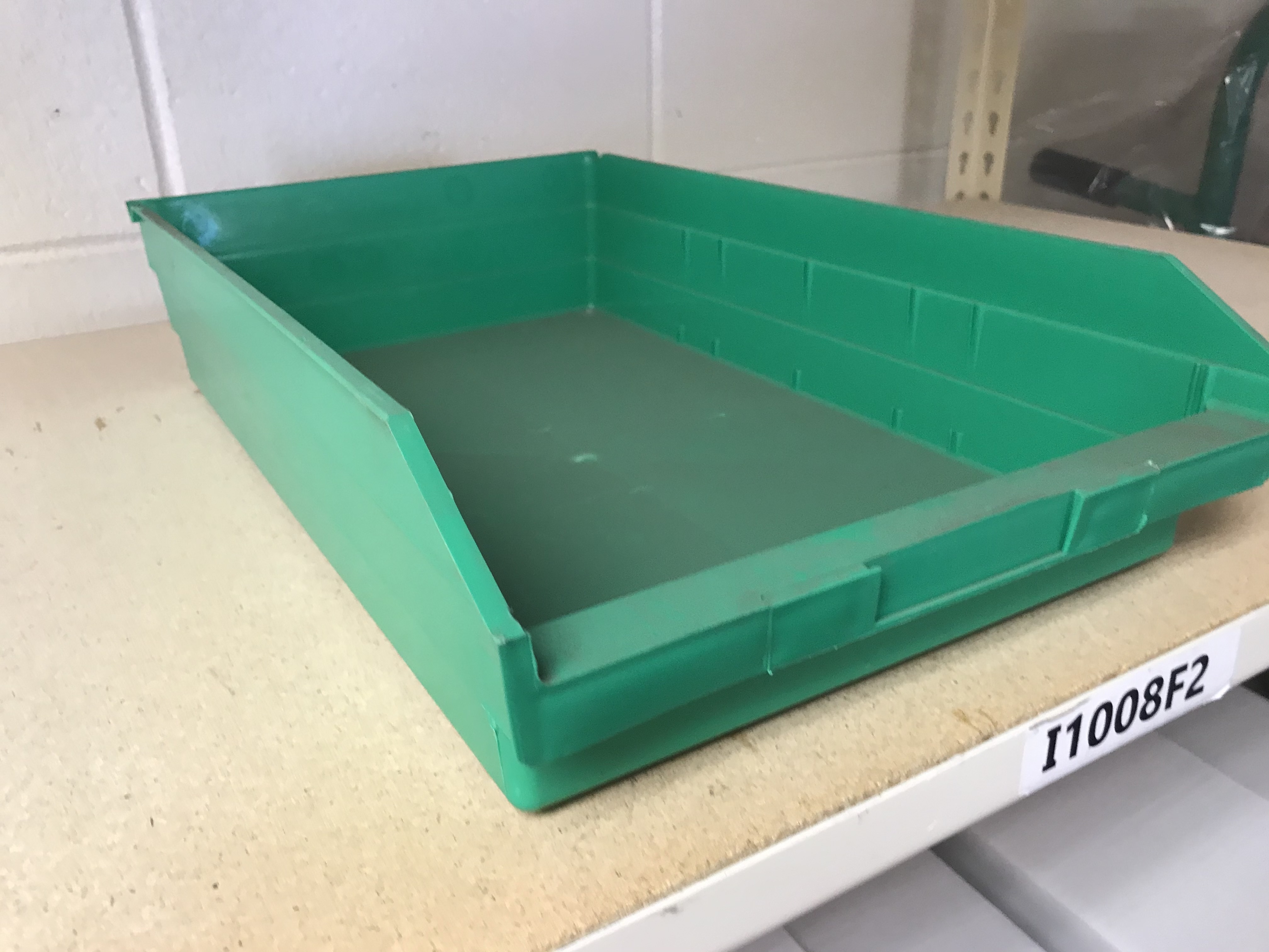 green plastic shelf bins